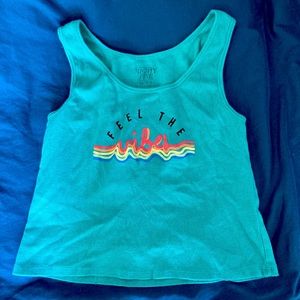 A large turquoise crop top from Mighty Fine!